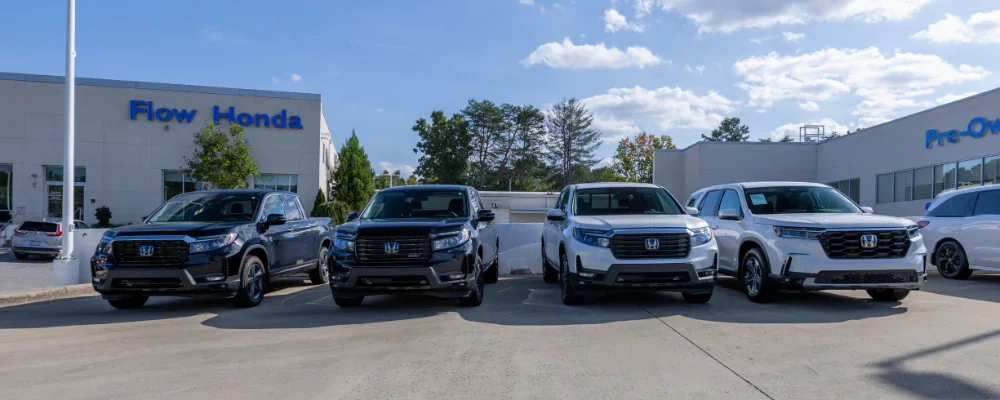 Lineup of Honda cars in front of the Flow Honda in Winston-Salem dealership